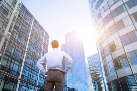 Man Standing by Skyscrapers Starting a New Career in a New City